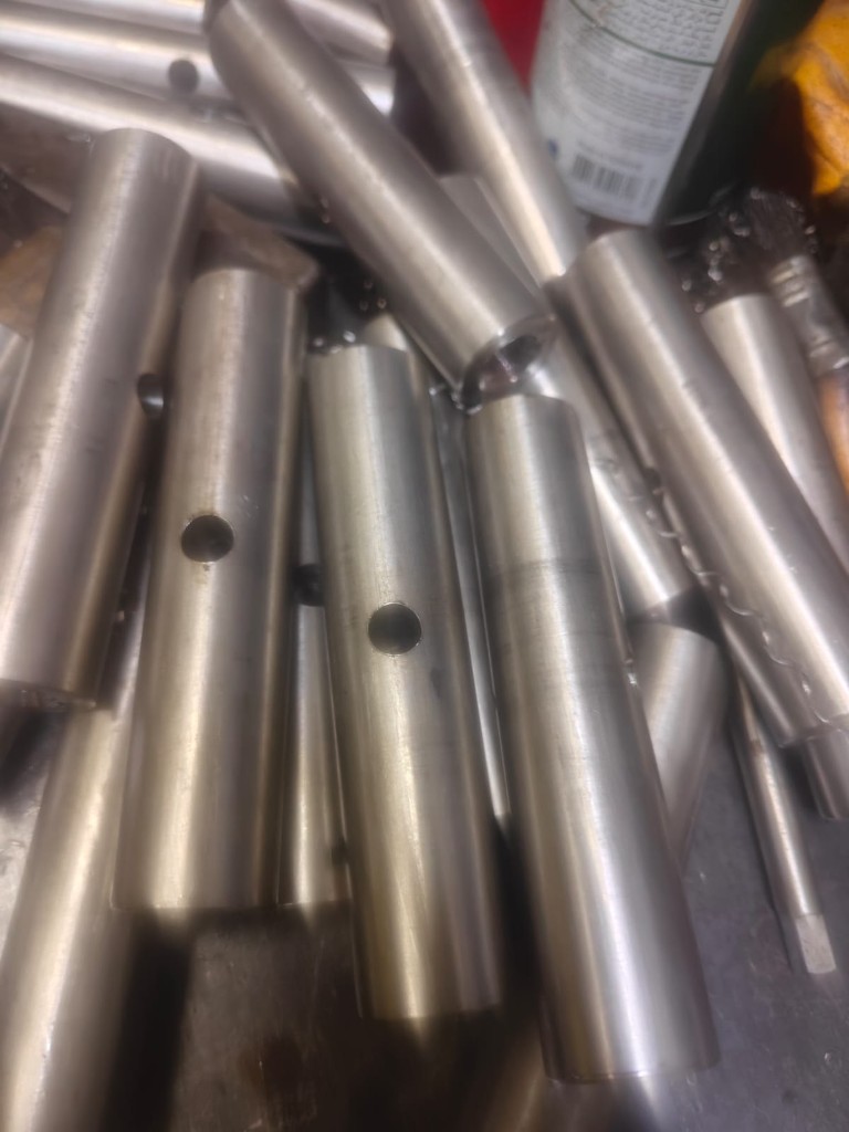 Crated precision parts with blue-wrapped components
