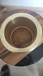 Brass cylindrical sleeve with concentric grooves